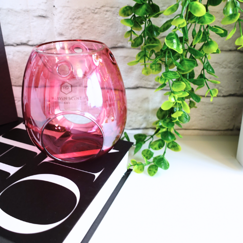 Add a touch of Sophistication and Style to your home with our stunning Pink Glass Wax Melt Burner. With its high-gloss finish and soft pink hue, this burner is the perfect blend of sophistication and modern elegance. Whether you’re looking to enhance your space with a decorative accent or indulge in your favourite home fragrances, this piece is a must-have.

Designed for both beauty and function, its open-cut design ensures optimal fragrance release, allowing your home to be filled with long-lasting.