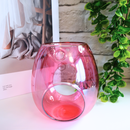 Add a touch of Sophistication and Style to your home with our stunning Pink Glass Wax Melt Burner. With its high-gloss finish and soft pink hue, this burner is the perfect blend of sophistication and modern elegance. Whether you’re looking to enhance your space with a decorative accent or indulge in your favourite home fragrances, this piece is a must-have.

Designed for both beauty and function, its open-cut design ensures optimal fragrance release, allowing your home to be filled with long-lasting.